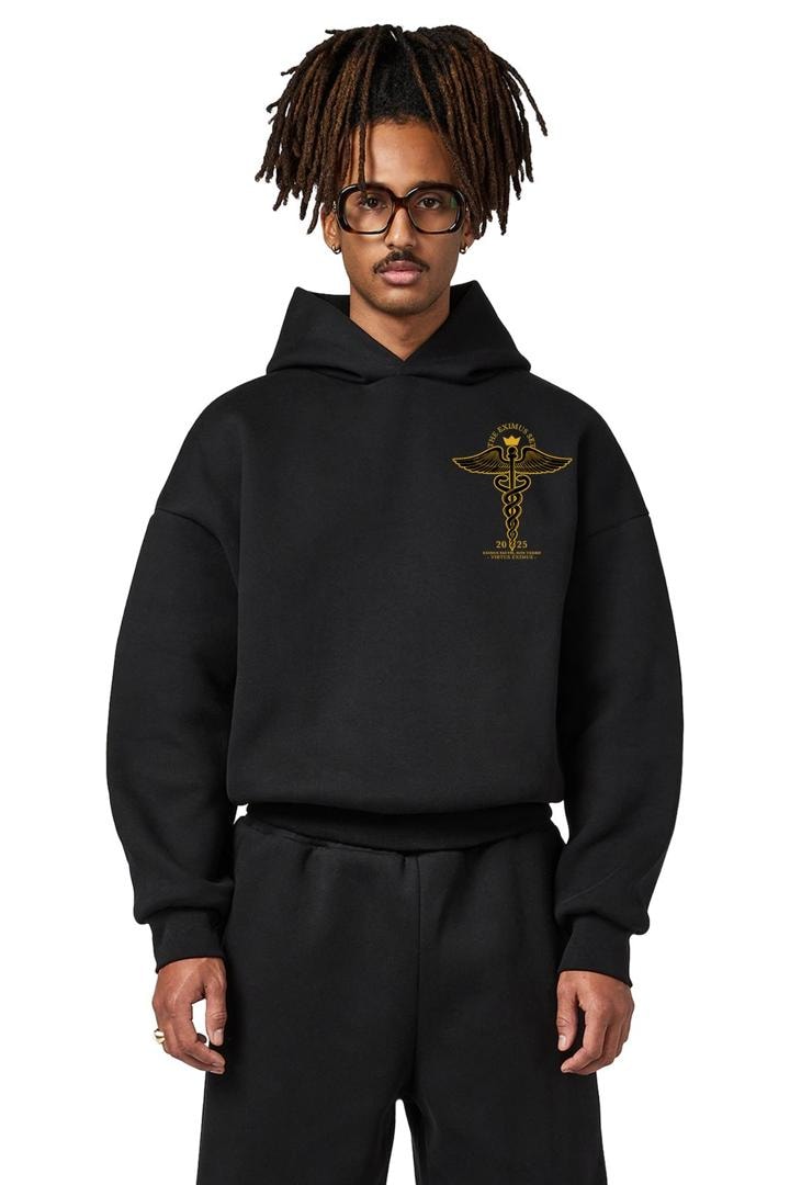 Eximius ’25 hoodie, black, gold caduceus crest on the left chest — worn
