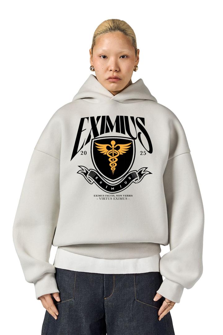 Eximius ’25 hoodie, white, full-front Eximius shield crest — worn